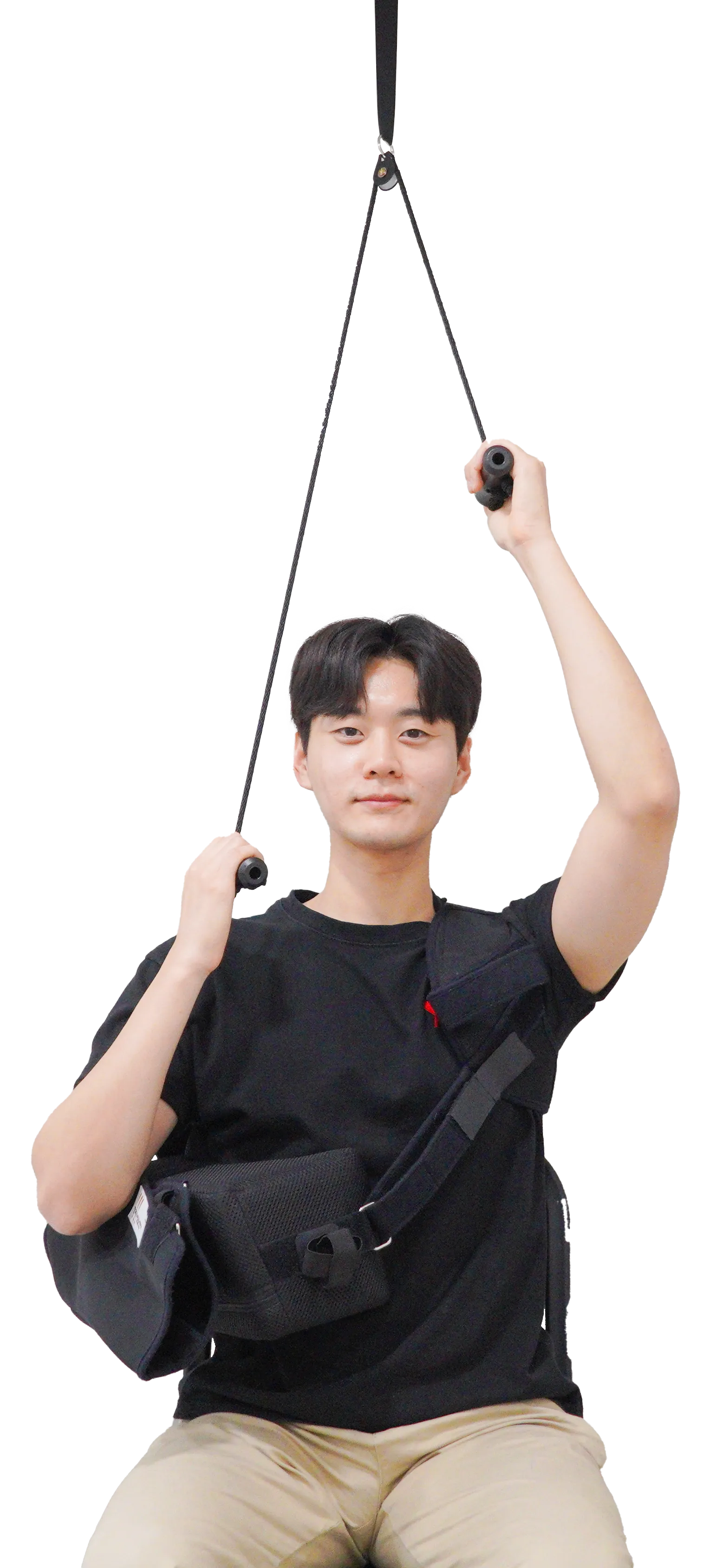 어깨 수술 후 도르래를 이용한 재활 운동. 천장에 매단 도르래에 줄을 걸어 반대쪽 팔로 잡아당겨 수술한 팔을 들어 올린다